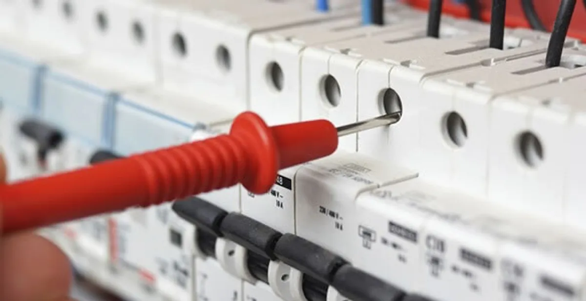 Electrical contractor testing circuit breakers during electrical repair in Palm Harbor, FL