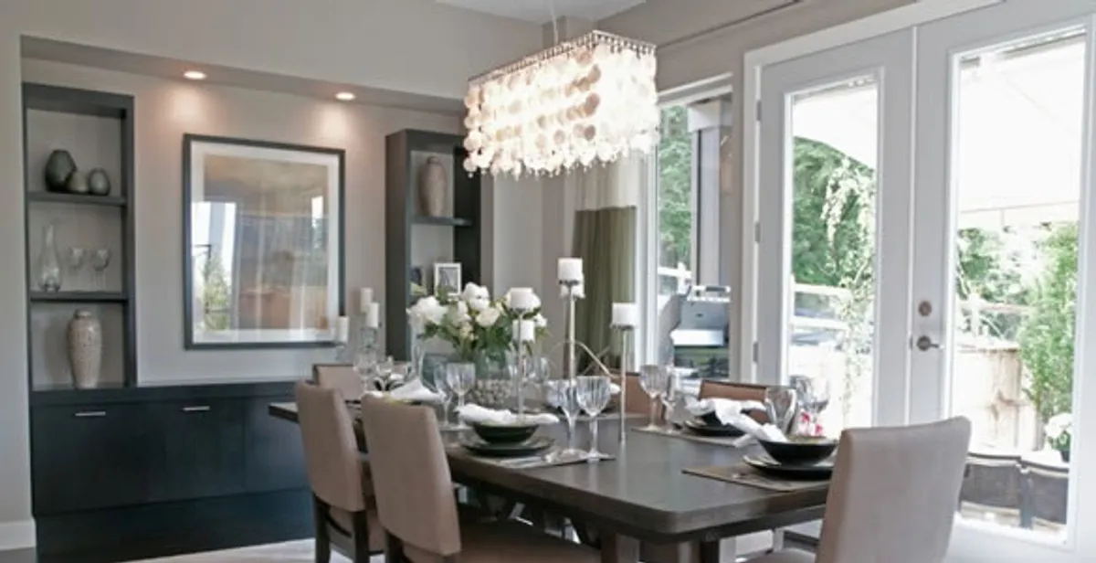 Elegant dining room chandelier installation above table in Clearwater, FL