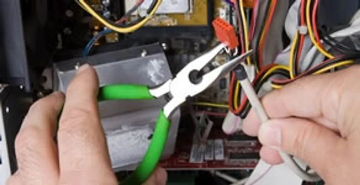 Licensed electrical contractor performing electrical repair with tools in Dunedin, FL