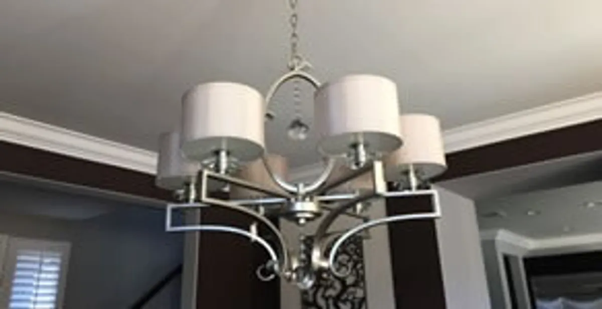 Modern chandelier installation with multiple light fixtures in Clearwater, FL